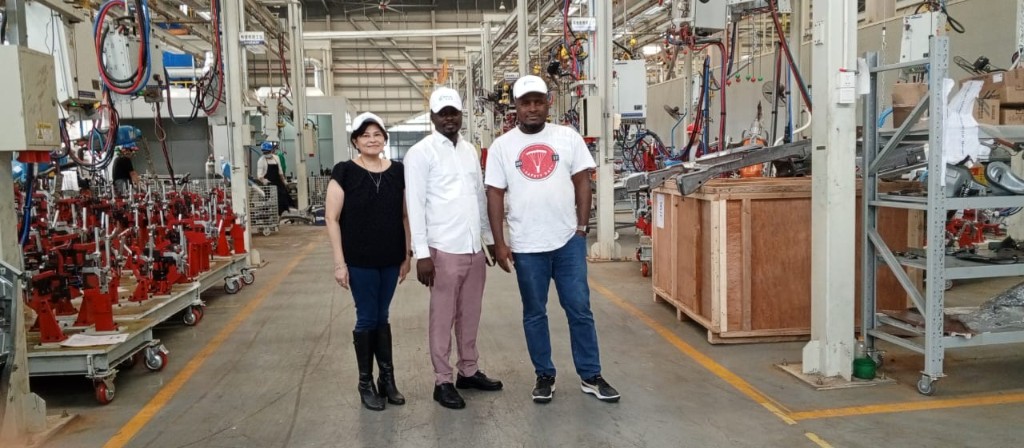 Oswald and partner teams touring the manufacturing facility