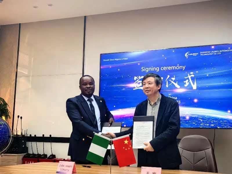 Partnership handshake at signing ceremony